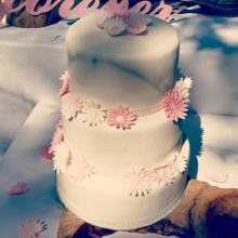 3 tier fruit cake with soft pink and white fondant gerberas